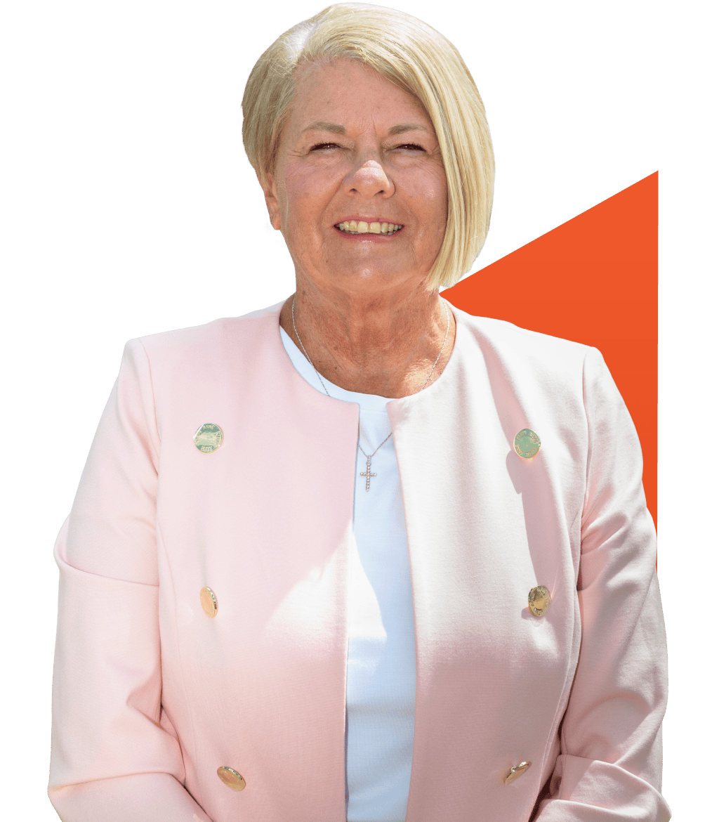 Rev Services - Cynthia Lail Portrait Headshot (Leadership Team) Portrait photo of Cynthia Lail with the REV Service orange shape